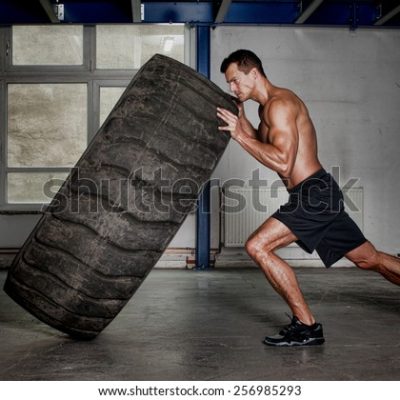 crossfit-training-man-flipping-tire-600w-256985293