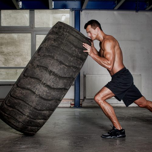 Crossfit,Training,-,Man,Flipping,Tire